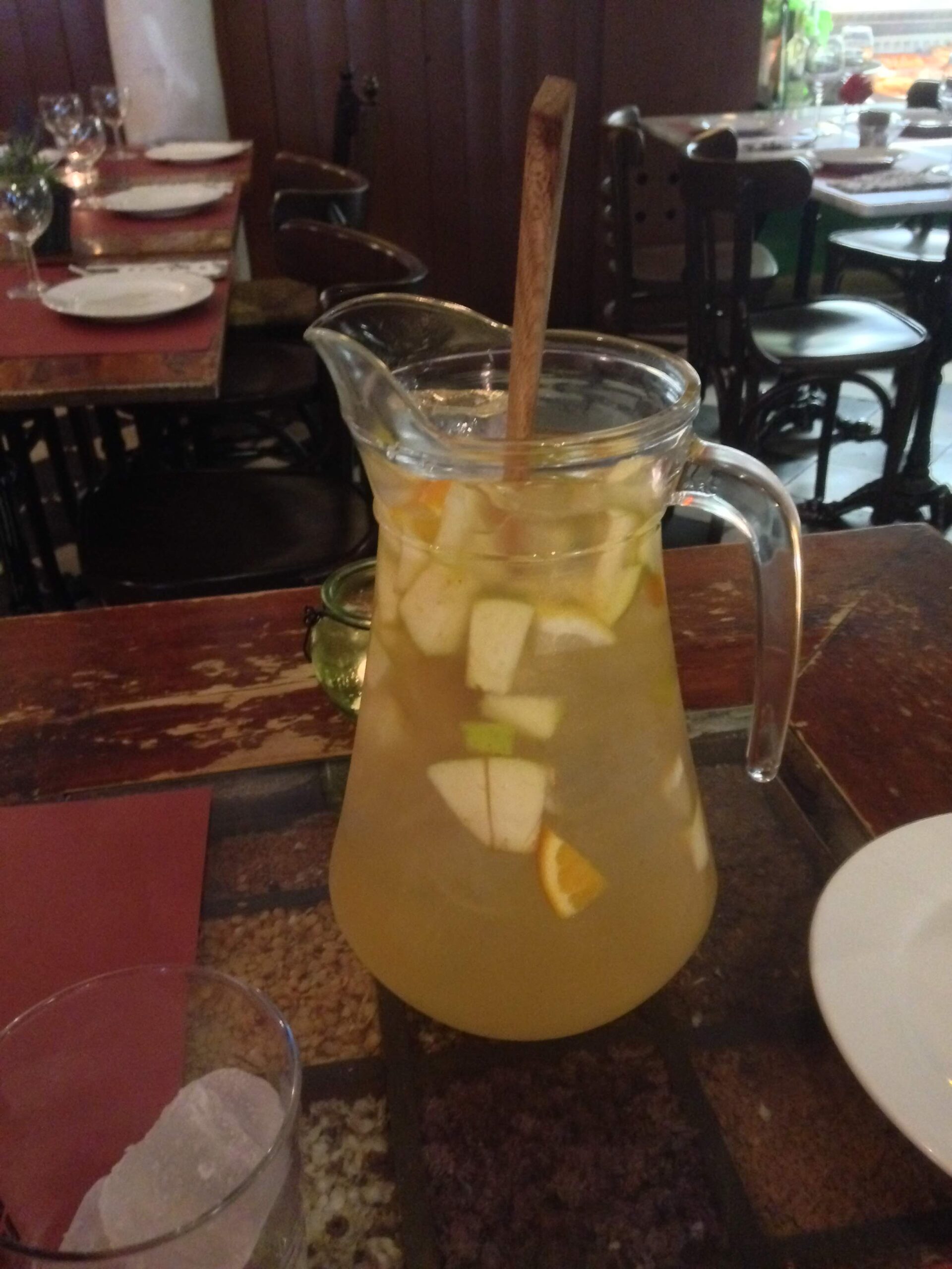 A see through pitcher with white sangria